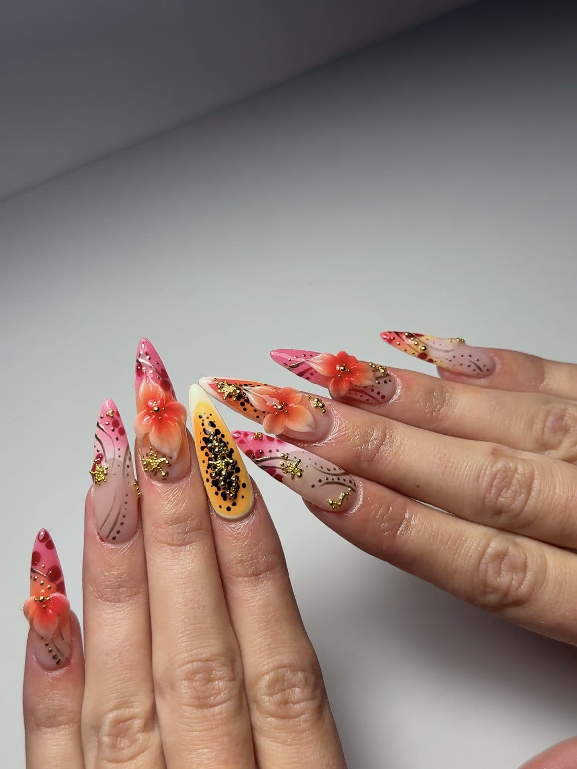 Stiletto Gel-X set with hand-painted papaya, red hibiscus flowers and gold leaf